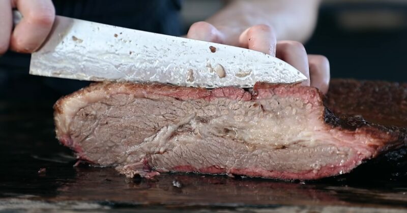 Cutting smoked brisket with a knife